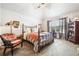 Elegant bedroom with decorative lamps, vintage furniture, and a light and airy feel at 2430 Tack Hill Ct, Dacula, GA 30019