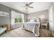 Bright bedroom with a large window, vaulted ceiling, and minimalist decor at 2430 Tack Hill Ct, Dacula, GA 30019
