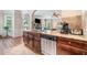 Kitchen featuring granite counters, a stainless dishwasher, and an eat-in bar at 2430 Tack Hill Ct, Dacula, GA 30019