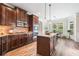 Kitchen featuring granite counters, a central island, and dark wood cabinets at 2430 Tack Hill Ct, Dacula, GA 30019