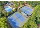 Aerial view of a neighborhood's tennis courts and pool area at 4910 Aldbury Ln, Suwanee, GA 30024