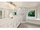 Large bathroom with lots of counter space, shower, tub, and natural light at 4910 Aldbury Ln, Suwanee, GA 30024