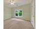 Neutral carpet and light green walls give this bedroom a clean, bright feel at 4910 Aldbury Ln, Suwanee, GA 30024