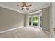 Inviting bedroom featuring a bay window and plush carpet at 4910 Aldbury Ln, Suwanee, GA 30024
