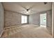 Spacious bedroom featuring neutral walls, fan, and plush carpet at 4910 Aldbury Ln, Suwanee, GA 30024