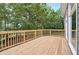 Spacious wooden deck with railing at 4910 Aldbury Ln, Suwanee, GA 30024