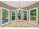 Dining room with large windows providing scenic views and natural light at 4910 Aldbury Ln, Suwanee, GA 30024