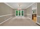 Elegant dining room with chandelier and natural light at 4910 Aldbury Ln, Suwanee, GA 30024