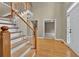 Spacious foyer with hardwood floors, staircase, and bright natural light at 4910 Aldbury Ln, Suwanee, GA 30024
