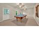 Spacious game room with a pool table, carpeted floors, two ceiling fans, and outside access at 4910 Aldbury Ln, Suwanee, GA 30024