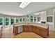 Open kitchen featuring stainless steel appliances, hardwood floors, and natural light at 4910 Aldbury Ln, Suwanee, GA 30024