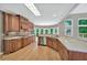 Spacious kitchen with wooden cabinets, granite countertops, and stainless steel appliances at 4910 Aldbury Ln, Suwanee, GA 30024