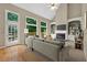 Staged living room with a fireplace, built-in bookshelves, and access to the deck at 4910 Aldbury Ln, Suwanee, GA 30024