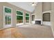 Living room with fireplace, built-in bookshelves, and natural light at 4910 Aldbury Ln, Suwanee, GA 30024