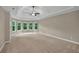 Spacious main bedroom featuring neutral colors and ample natural light at 4910 Aldbury Ln, Suwanee, GA 30024