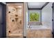 Bathroom featuring a tub, and stand up shower with seamless glass door at 501 Rabun Ct, Canton, GA 30115