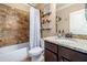 Bathroom featuring granite vanity and updated tile in the tub and shower at 501 Rabun Ct, Canton, GA 30115