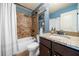 Bathroom features granite countertop, brown tile shower, and white shower curtain at 501 Rabun Ct, Canton, GA 30115