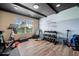 Exercise room with workout equipment, a painted accent wall, and natural light at 501 Rabun Ct, Canton, GA 30115