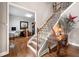 Foyer with hardwood floors, and stairway with iron spindles at 501 Rabun Ct, Canton, GA 30115