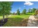 Lush green front lawn and sidewalk, providing a welcoming entrance to the neighborhood at 501 Rabun Ct, Canton, GA 30115