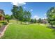 Beautifully landscaped front yard with a view of the well-maintained lawn and surrounding homes at 501 Rabun Ct, Canton, GA 30115