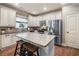 Modern kitchen with granite countertops, stainless steel appliances, and a pantry at 501 Rabun Ct, Canton, GA 30115