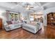 Open living area with hardwood floors, coffered ceilings, and lots of natural light at 501 Rabun Ct, Canton, GA 30115