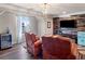 This living room features wood accent wall and a beverage refrigerator at 501 Rabun Ct, Canton, GA 30115