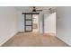 Bedroom featuring a sliding barn door to the en suite bathroom at 6006 Lanier Heights Cir, Buford, GA 30518