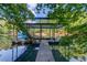 A dock with a covered upper deck, providing scenic views of the lake and surrounding trees at 6006 Lanier Heights Cir, Buford, GA 30518