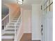 Bright foyer featuring staircase and modern finishes at 6006 Lanier Heights Cir, Buford, GA 30518