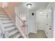 Inviting foyer with hardwood style flooring and an open staircase at 6006 Lanier Heights Cir, Buford, GA 30518