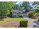 Charming two-story home featuring a well-manicured lawn, two-car garage, and classic curb appeal at 6006 Lanier Heights Cir, Buford, GA 30518