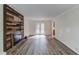 Spacious living room featuring a wood accent fireplace and elegant gray wood flooring at 6006 Lanier Heights Cir, Buford, GA 30518