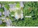 An aerial view shows the home's pool, tennis court, landscaping, and parking lot, surrounded by lush trees at 789 Houston Mill Ne Rd # 5, Atlanta, GA 30329