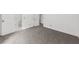 Spacious bedroom with wall to wall carpet and white baseboards leading to multiple closets and a bathroom at 789 Houston Mill Ne Rd # 5, Atlanta, GA 30329