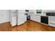 Traditional kitchen with white cabinetry, modern appliances, and unique basket weave hardwood flooring at 789 Houston Mill Ne Rd # 5, Atlanta, GA 30329