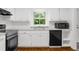 Bright kitchen featuring white cabinetry and black dishwasher at 789 Houston Mill Ne Rd # 5, Atlanta, GA 30329