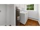 Functional laundry room with a washer, and water heater, plus natural light from the window at 789 Houston Mill Ne Rd # 5, Atlanta, GA 30329