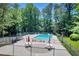 Outdoor pool with lounge chairs surrounded by lush greenery at 789 Houston Mill Ne Rd # 5, Atlanta, GA 30329