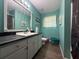 Bathroom with sleek vanity, modern mirror, updated lighting, and stylish tile flooring at 124 Tyler Dr, Mcdonough, GA 30252