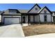 Charming, modern farmhouse-style home with a two-car garage, covered porch and manicured lawn at 214 Saratoga Dr, Acworth, GA 30102