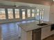 Open-concept kitchen features stainless appliances, granite countertops, and seamless flow to living space at 214 Saratoga Dr, Acworth, GA 30102
