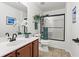 Neutral bathroom featuring a white vanity, toilet, and a shower with a framed enclosure at 4068 Cottage Oaks Dr, Acworth, GA 30101
