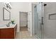 Modern bathroom featuring a glass shower, walk-in closet, and granite countertop vanity at 4068 Cottage Oaks Dr, Acworth, GA 30101