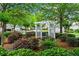 A lovely community garden featuring seating beneath a trellis offers a relaxing space for residents to enjoy nature at 4068 Cottage Oaks Dr, Acworth, GA 30101