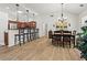 Bright dining area with barstool seating, modern lighting, and an adjacent kitchen at 4068 Cottage Oaks Dr, Acworth, GA 30101