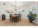 Well-lit dining room features a chandelier, hardwood floors, lots of natural light, and room for a large table at 4068 Cottage Oaks Dr, Acworth, GA 30101