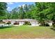 Well-maintained townhomes featuring attached garages and manicured landscaping at 4068 Cottage Oaks Dr, Acworth, GA 30101